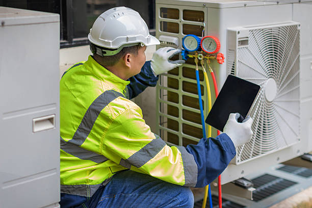 Professional Air Conditioning Repair technician working in Cable, OH